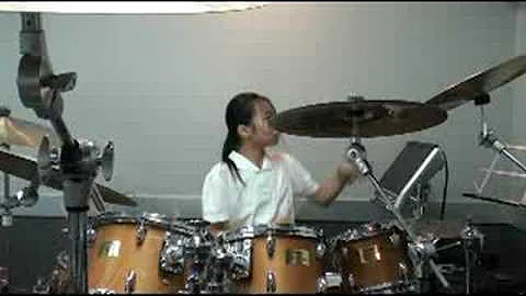 Sara, 13-yrs girl, plays RUSH - YYZ  with stick pe...