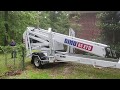 Dino Lift 85ft Towable at the job site, handling unlevel ground easily