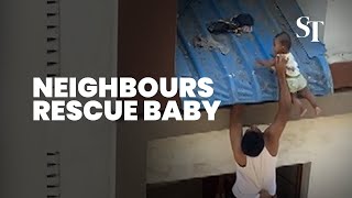 Dramatic Rescue Of Baby Dangling Off A Roof In India