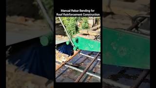 Manual Rebar Bending for Roof Reinforcement Construction.