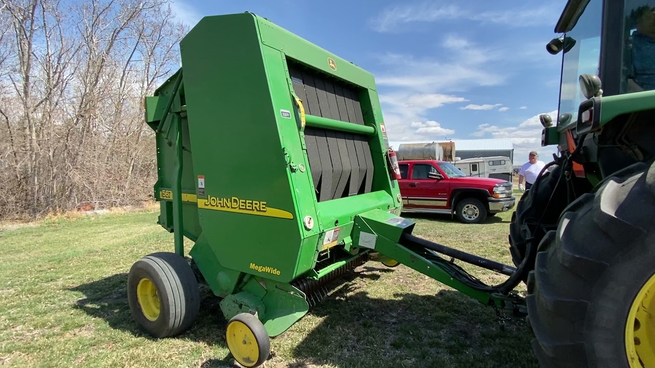 SOLD *2002 JD 567 rd baler w/Mega Wide pick-up