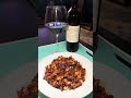 Sausage puttanesca over chickpea pasta