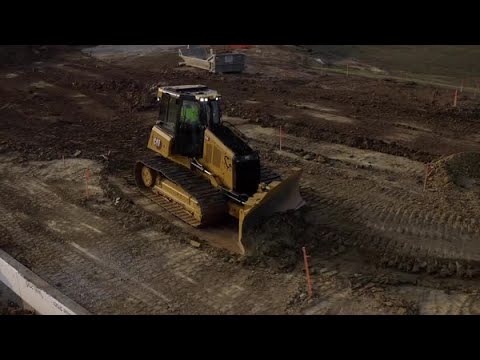 Cat® D4 dozer at Work | Finish Grading on a Building Site