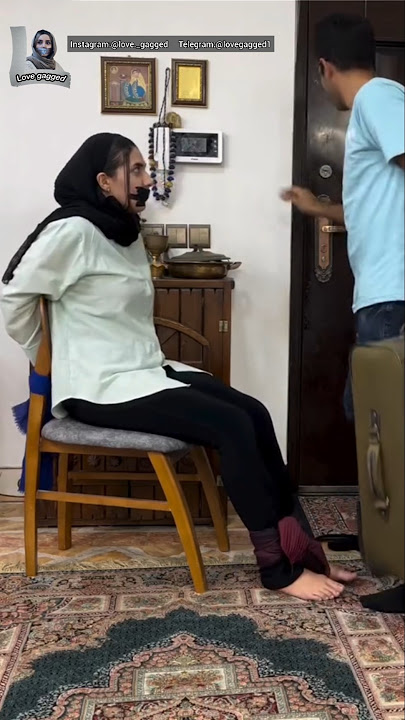 persian woman tape gagged and tied up to chair