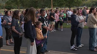 Community unites at candlelight vigil for missing boy whose body was found on Sunday