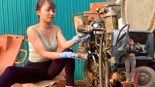 Genius girl repairs and maintains excavators and fixes truck doors