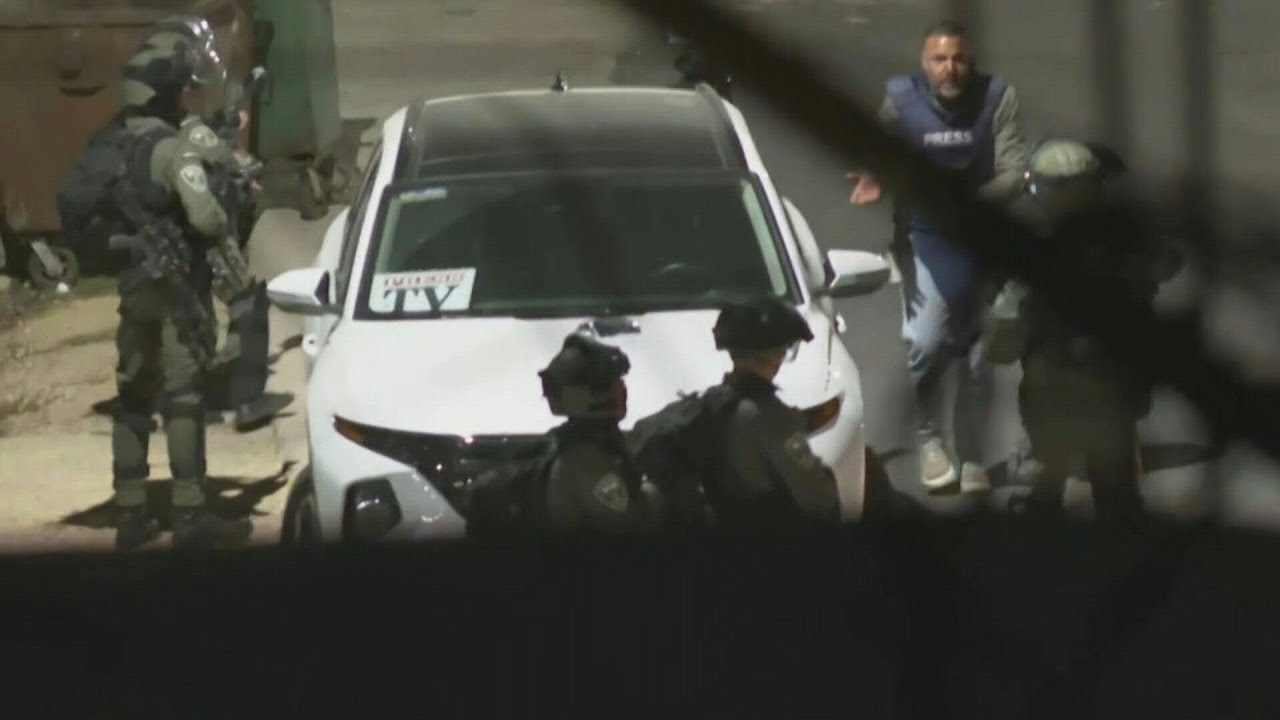 Journalists take cover as Israeli forces fire rubber bullets outside Ofer prison AFP YouTube