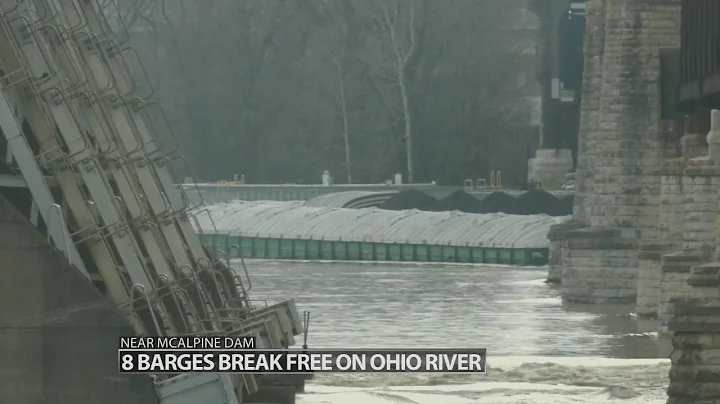 8 barges break loose near dam by Falls of the Ohio...