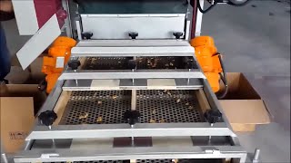 Kem-P Vibration Motors - Sorting the cracked walnuts by inserting them into a sieve.
