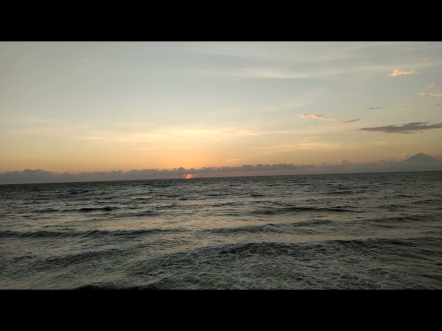 Sunset at Lombok, Indonesia. Volcano Mount Agung at the background class=