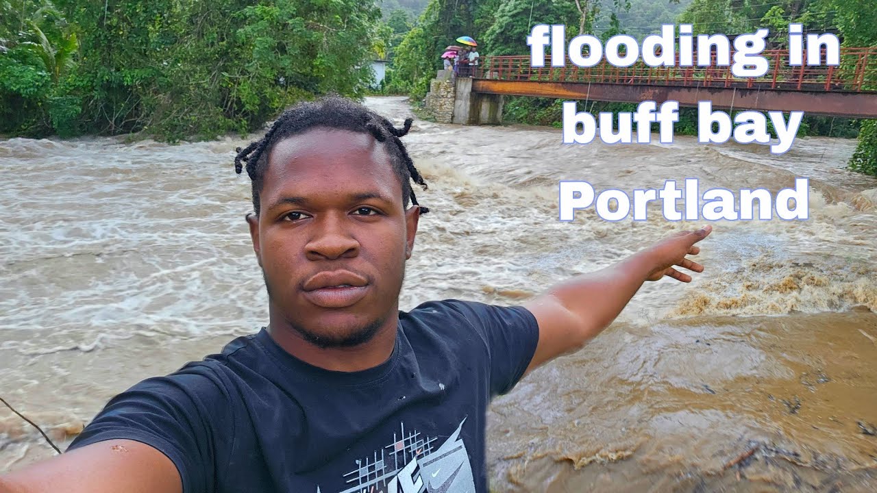 FLOODING IN BUFF BAY PORTLAND THIS RIVER IS OUT OF CONTROL ROAD COVERED 