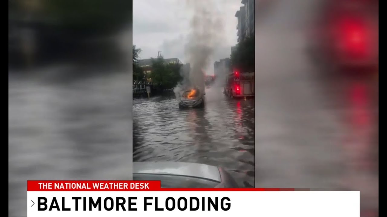 Today's TNWD: One of many cars that stall in Baltimore floodwaters catches on fire.