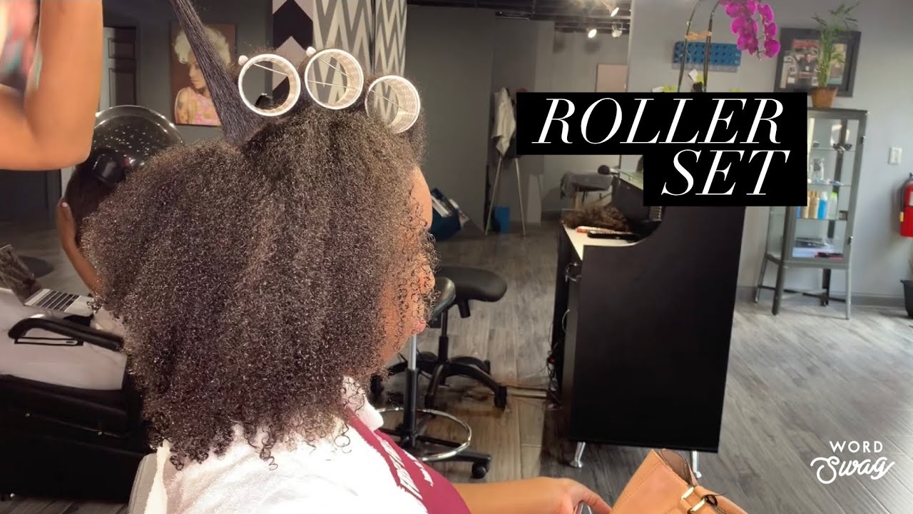 ⁣Tension roller set on natural hair