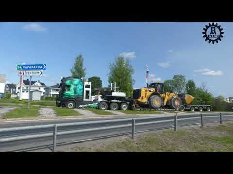 Scania R650 loaded with a CAT 980M and Volvo FH16 750 with crusher parts