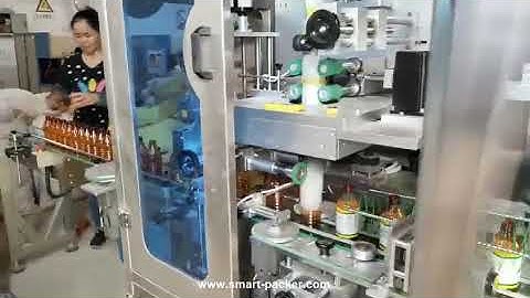 Automatic empty bottle sleeve inserting film cut labeling shrink sealing machine sleeve applicator l