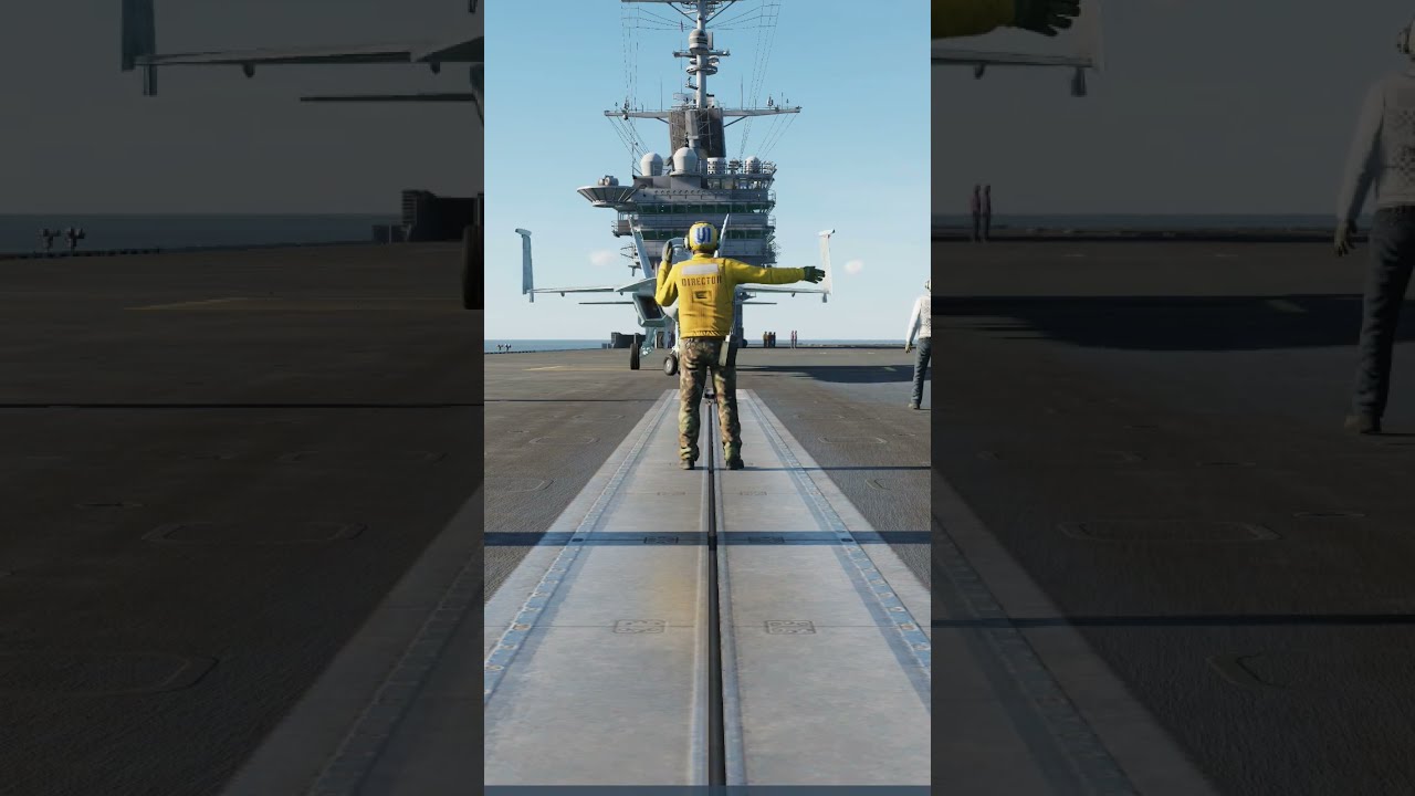 Aircraft Carrier Flight Director Gives hand signals to a f-18 super ...