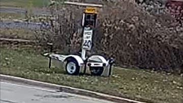 Traffic Speeds 50-55mph Past Electronic Speed Sign, as Cars Turn Along Resid Lined 40mph Legacy Hwy