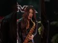 黒レザーボディスーツでサックス演奏『ななえサックスさん』名古屋オートフェスティバル2026