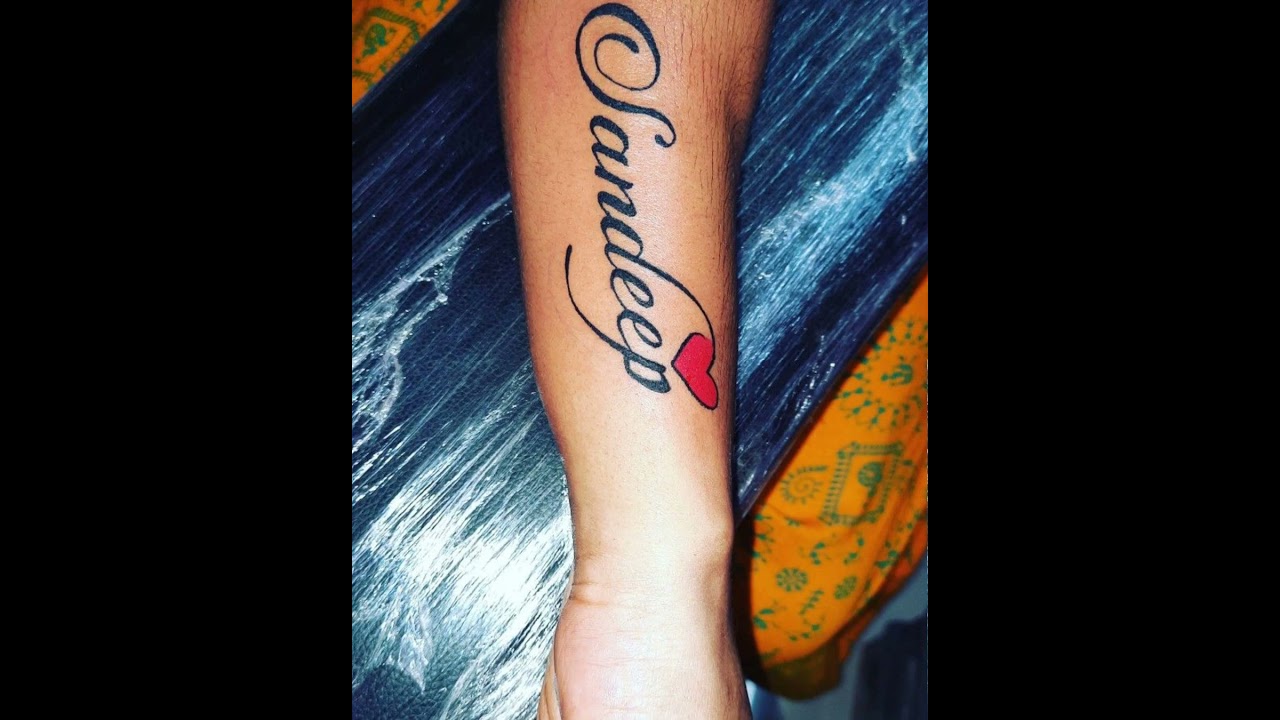 Sandip Name Tattoo in peacock Feather,Linestar Tattoo Studio,wadala,Mumbai  | Peacock feather tattoo, Tattoos, Feather tattoo