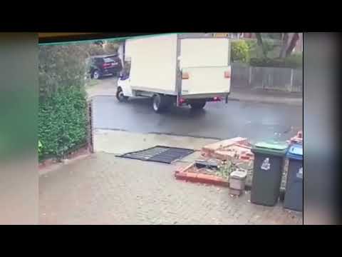 Shocking video shows van driver reversing into resident's wall and tearing it down