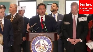 JUST IN: Protesters Interrupt Gov. Ron DeSantis And Drop Fake Money On Him During Speech