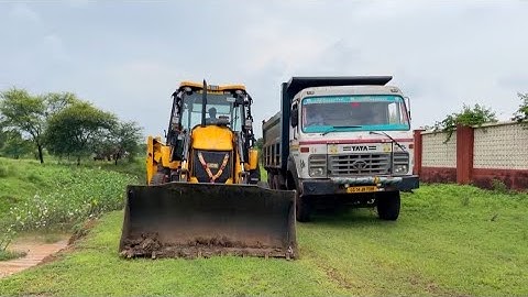 JCB 3DX fully loading mud in Tata 2518 truck