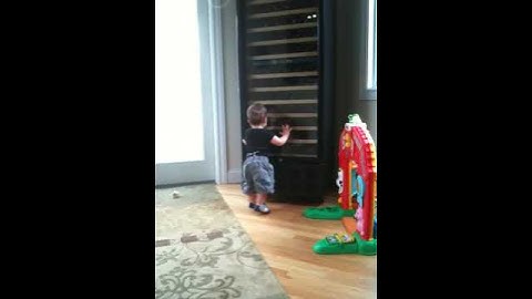 Who is that baby in the wine cabinet?