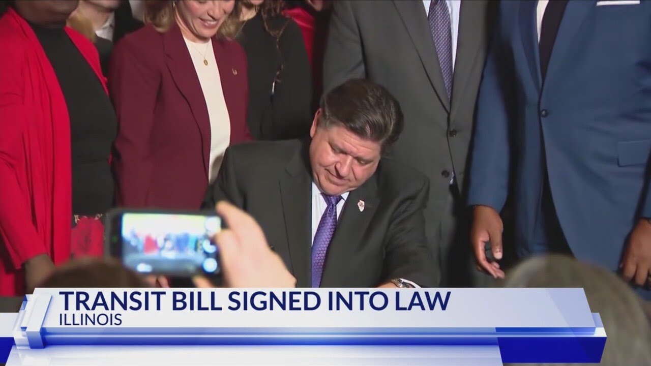 QCA leaders join Illinois Gov. Pritzker as he signs Transit Bill - YouTube