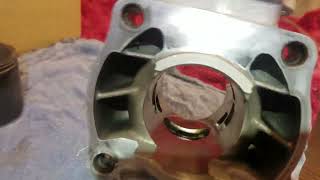 1:11 My YZ250 top end rebuild (Part 2) Piston comparing and power valve swamping to new cylinder