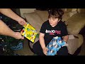 Tristan opening a gift on Christmas Eve 2017