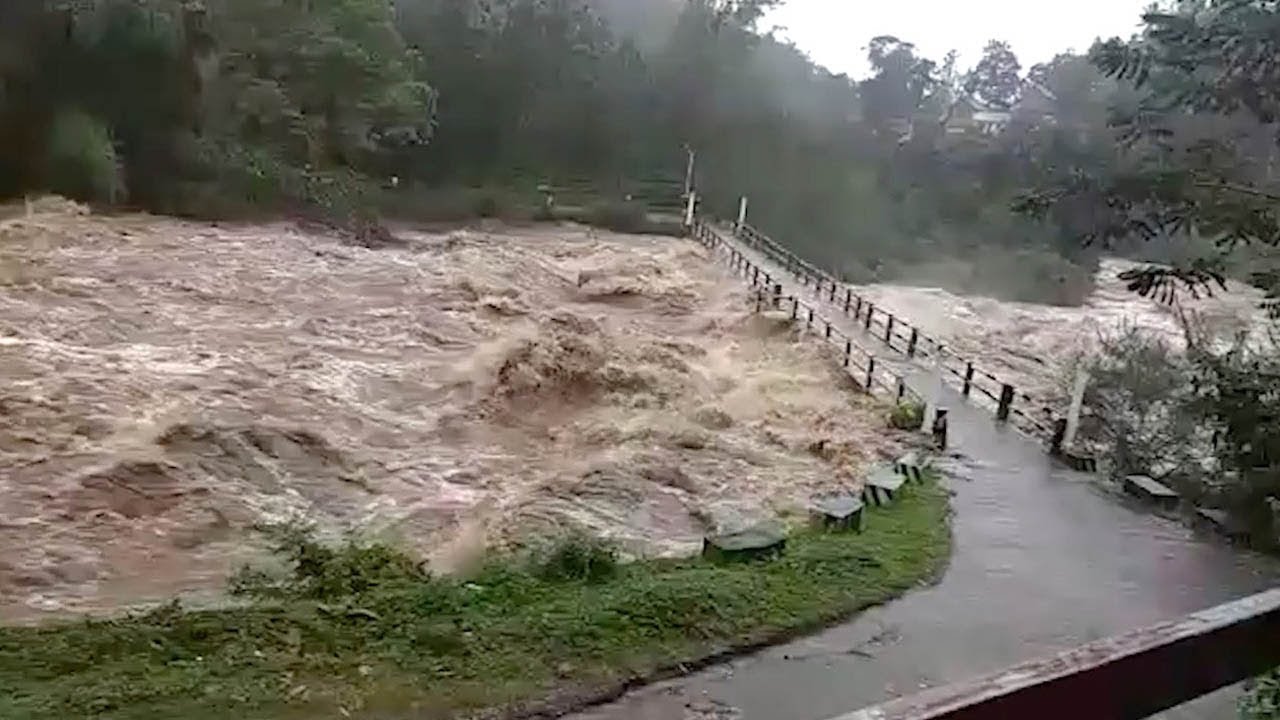 Flood On The River In The Monsoon Rains Cause River To Flood Bridge In Kerala