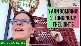 AC Moore shopping cart yarn bomb! Stringing up the lights #acmoore #yarnbombing #shoppingcart #yarn