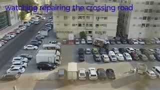 Watching repairing crossing road at sharjha abushagara Dubai 
