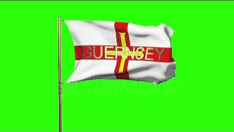 Guernsey flag with title waving in the wind. Looping sun rises style. Animation loop Stock video by