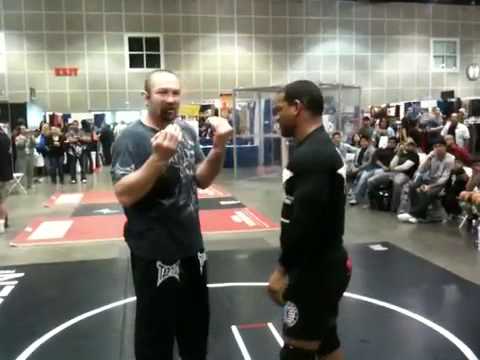 Vladimir Matyushenko And Hector Lumbard fighting at the Fit Expo