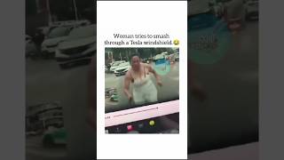Woman With A Bat Tries To Jump Onto The Hood Of A Tesla And Smash Through The Windshield