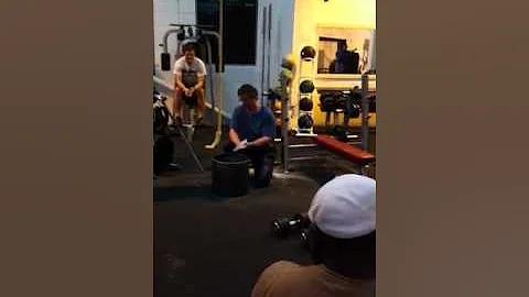Brooks Kubik lifting two 36 kg dumbbells in London