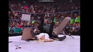 Bubba Ray Dudley powerbombs Barbara Bush through table