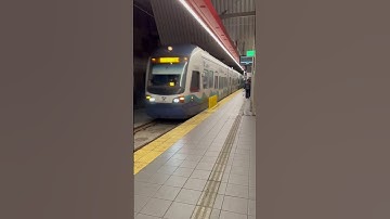 Sound transit light rail train arriving at U district station