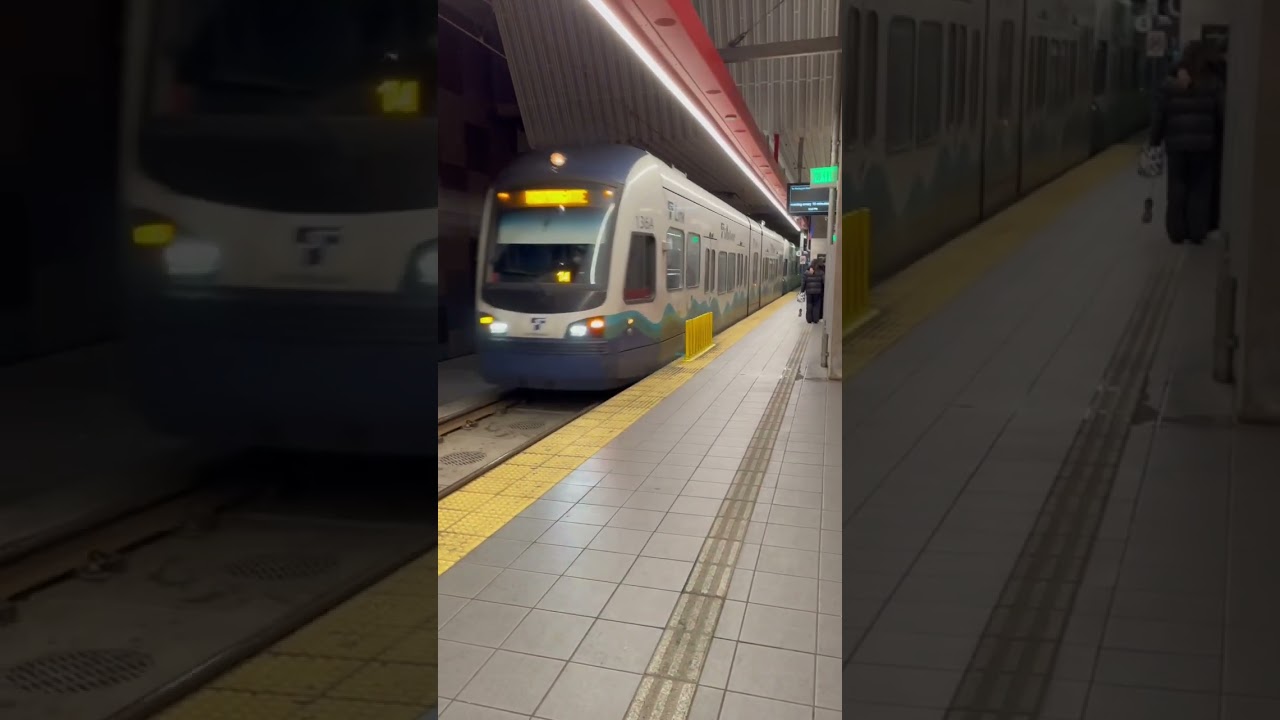 Sound transit light rail train arriving at U district station