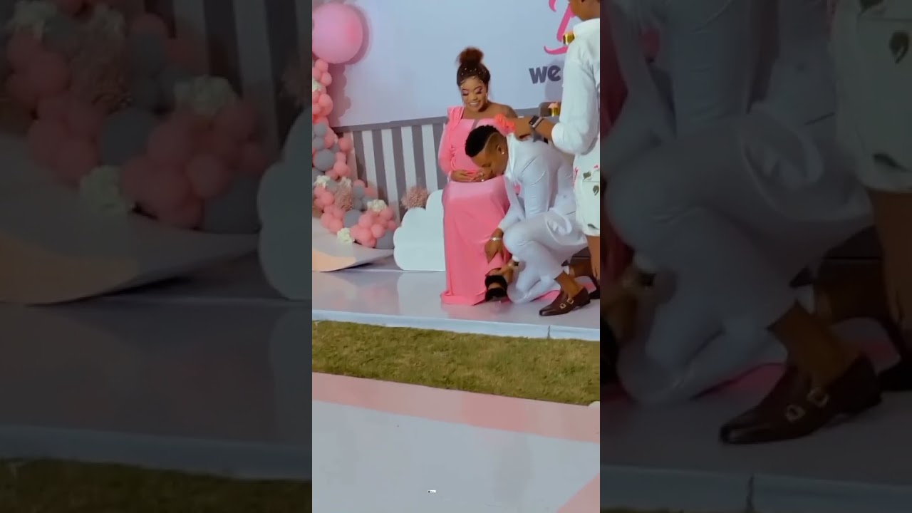 Brown Mauzo massages VERa SIDIKA'S feet during her baby shower. 