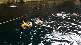 Swimming with Baby in The Sacred Cenote at Chichén Itza Mexico