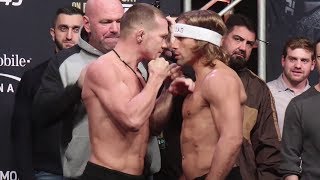 Petr Yan tries to make Urijah Faber flinch during UFC 245 ceremonial face off