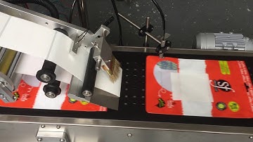 Plastic /paper bags labeling machine test video 1