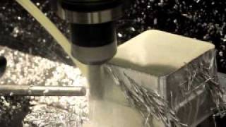3 Axis CNC Mill Cutting a engine exhaust spacer.AVI