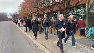 People walking past City Hall, homeless challenge