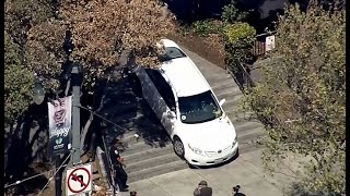 UBER DRIVER ON STAIRS:  Raw video of Uber vehicle stuck on stairs near SF Safeway