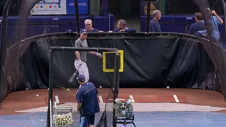 Joyce hits a ball into the pitching machine