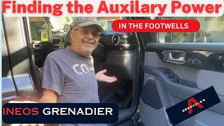 How to find the auxiliary power locations in the Ineos Grenadier footwells.