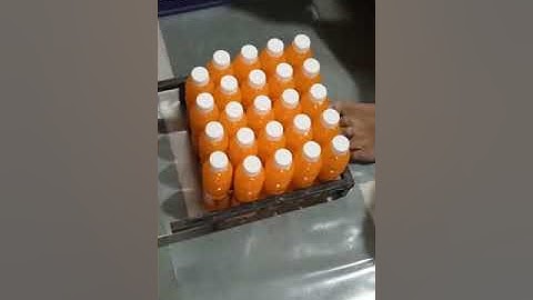 Manually Shrink film use to pack Juice/Soda bottles with Hot air gun